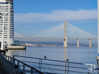 Fototapeta premium Vasco da Gama bridge in the Parque das Nacoes (Park of Nations) in Lisbon is a Modern Cultural Center And A Place For A Shopping Mall,