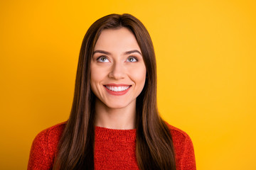 Fototapeta premium Portrait of positive cheerful lady have weekends look up try imagine what is there in space wear red pullover isolated over yellow color background