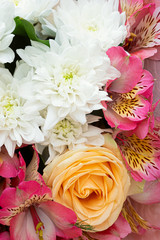 Natural  chrysanthemums, alstroemeria and  orange rose in a bouquet