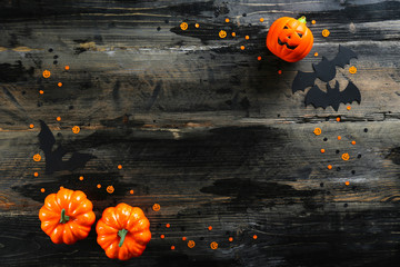 Bunch of candy corn sweets as sybol of Halloween hoiday on textured background with a lot of copy space for text. Flat lay composition for all hallows eve. Top view shot.