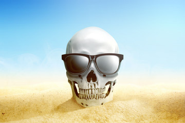 Human skull with sunglasses on the sand