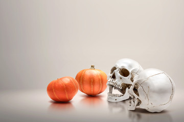 Pumpkin and human skull