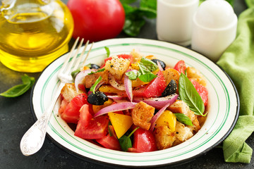 Italian salad with bread and vegetables or Panzanella salad