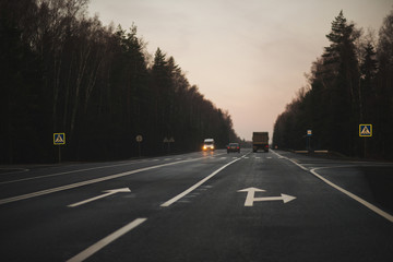 Car trip. View of the road from the car in the early morning.