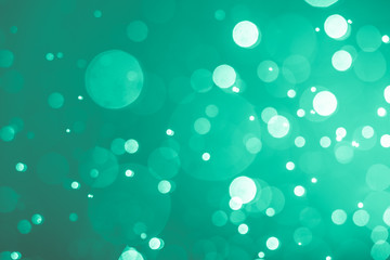 Abstract Green bokeh defocus glitter blur Background.