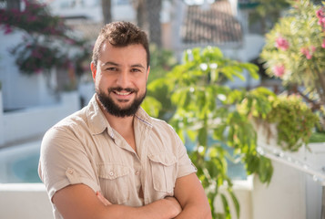 Gardener posing looking at camera in sunny summer day