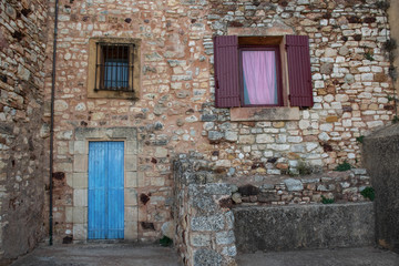 Fototapeta na wymiar Front of old stone house at Roussillion
