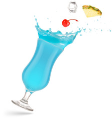 pineapple, cherry and ice cube falling into a splashing blue hawaiian isolated.on white
