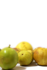 fresh and green lemon with tainted lemon on a white background