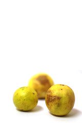 fresh lemon with tainted lemon on a white background