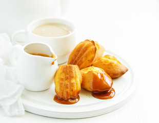 Madeleine french cookies with caramel. selective focus.