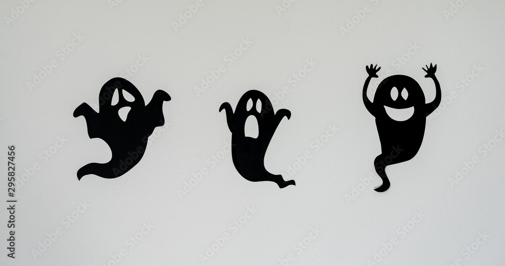 Fototapete Table top view aerial image of decoration Happy Halloween day background concept.Flat lay accessories essential object to party the black ghost on rustic white stone.Space for creative design text.