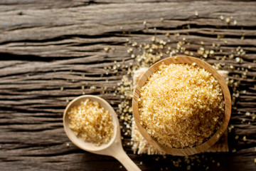 Brown sugar in a wooden cup.