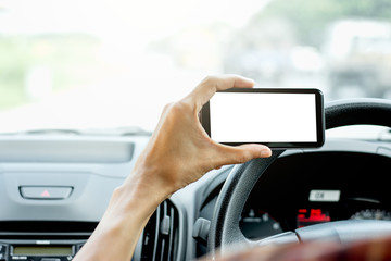 The hand of men are using smartphones in cars.