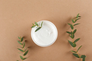 Moisturizing care skincare face cream for healing complicated troubled skin type in an open jar...
