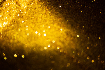 golden blur abstract background. yellow bokeh christmas blurred beautiful shiny Christmas lights