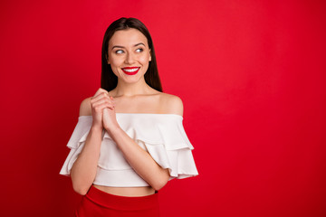 Portrait of lovely person place hands together looking having thoughts isolated over red background