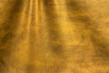 Texture cuir jaune doré avec plis