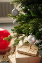 Gift boxs wrapped in recycled paper with bow. Merry Christmas and Happy Holidays! Christmas gift box against bokeh background. 