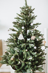 Christmas / New Year composition. Festive fir-tree decorated with toys, gifts, balls. Winter...