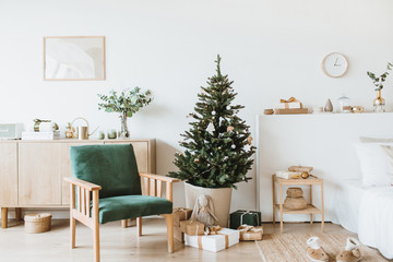 Modern interior design living room with Christmas / New Year decorations, toys, gifts, fir tree....