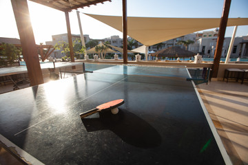 ping-pong table with racket and ball