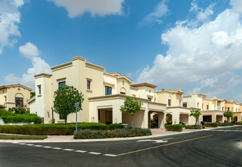 Luxury villa compound housing development with beautiful blue sky with white clouds