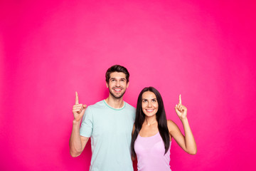 Photo of sale managers guy and lady indicating fingers up empty space advising black friday low prices shopping wear casual outfit isolated pink color background