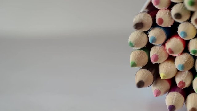 pack of colored pencils in different colors rolls on a light surface.close-up.shallow depth of field