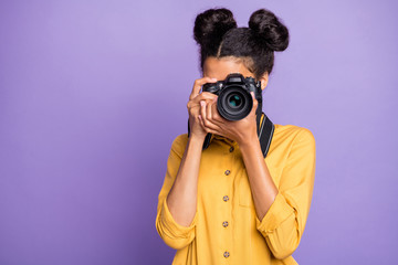 Photo of amazing dark skin lady holding photo digicam in hands photographing foreign sightseeing abroad wear yellow shirt trousers isolated purple color background - obrazy, fototapety, plakaty