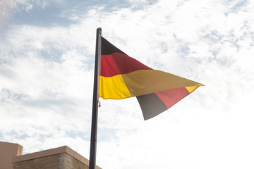 German flag on sky background