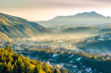 Beautiful scenery landscape Romania Magura Pestera village mountains hills fields foggy morning