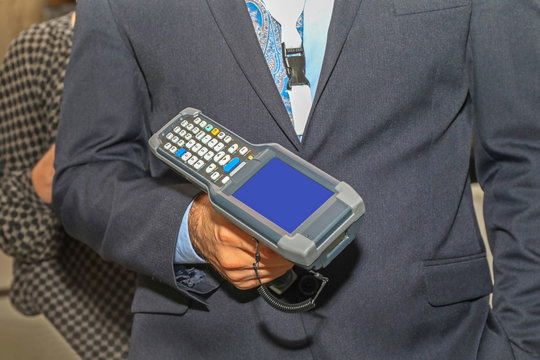 Man Holding Barcode Scanner