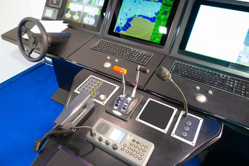 The captain bridge of the ship. Equipment to control the vehicle. Simulator for sailors. Navigational instruments on the captain bridge. Ship control.