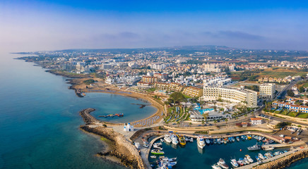 Cyprus. Protaras. The Port Of Paralimni. Pernera. Panorama of the Mediterranean coast from a height. Top view of kalamies beach. Church of St. Nicholas in Cyprus. Cyprus beach resort. Boat Harbor.