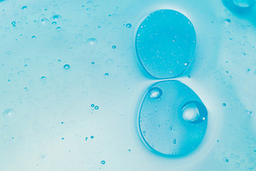 Oil bubbles in water, round abstract drops.