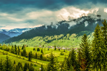Obraz premium Beautiful landscape mountain hill meadow sunrise morning village Bucovina Romania 