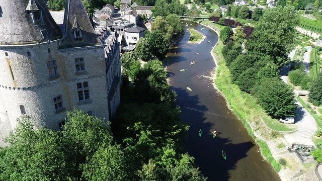 Aerial 4K footage, over the valley, where Durbuy Castle is located. Belgium, province of Luxembourg in the Wallonia region. Beautiful landscape with river, sunny weather during summer season.