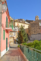 Obraz premium Province of Salerno, Italy, 10/21/2017. A narrow road between the old houses of a rural village.