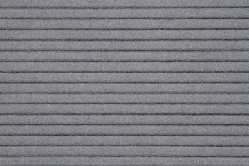 Gray textured grooved lines felt fabric material background
