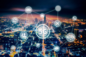 aerial view city at  night  and 5g network  tech concepts