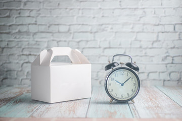 Takeaway Time Concept - Blank Takeaway box and alarm clock