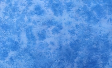 Background of dyed fabric. Beautiful abstract background. Sky, sea, blue background