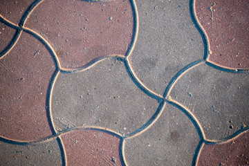 Texture of paving slabs overgrown with grass. Background image of a stratum stone