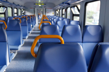 free passenger seats in an empty car of the city train