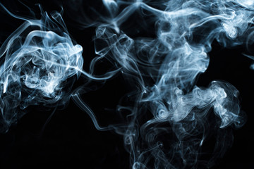 Photo of a wisp of smoke on a dark background