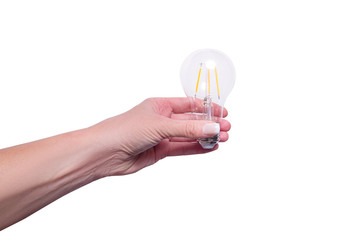 Woman hand holding energy saving lamp, isolated