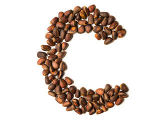 Isolated object: letter lined with ripe pine nuts