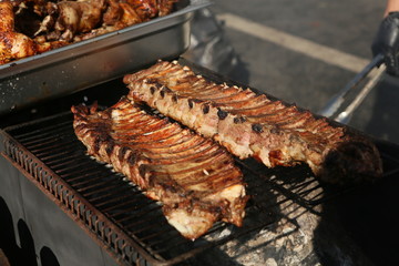 Mixed grilled meat platter. Assorted delicious grilled meat. The closeup of some meat skewers being grilled in a barbecue. grilled meat skewers, barbecue.