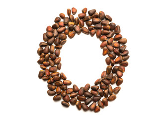 Isolated object: letter lined with ripe pine nuts